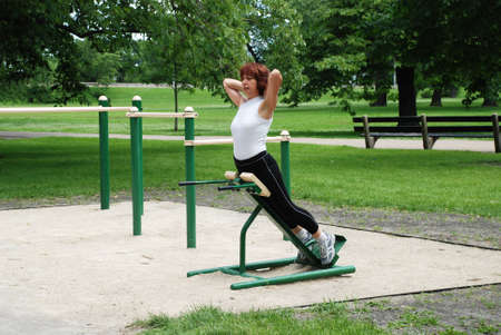Woman doing morning exercises outdoors