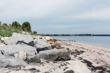 Huge boulders on the shore of the Gulf of Mexico in  Fred Howard Park, Florida, USAの写真素材
