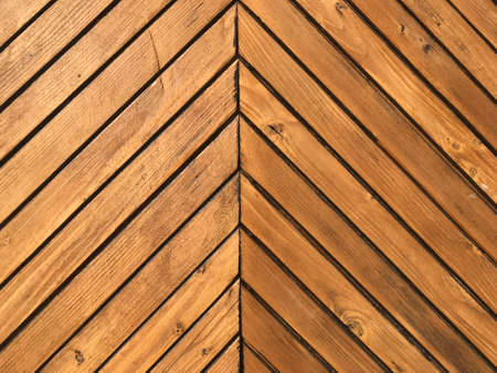 Wooden door made of brown planksの写真素材