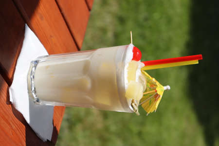 Refreshing, summer drink pina colada with coctailÂ´s umbrella.の写真素材