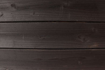 Texture of horizontally folded planks. Dark brown with a touch of gray.の写真素材