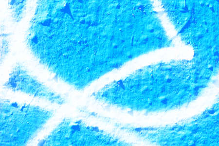 Blue and white sprayed wall texture. Part of graffiti.の写真素材