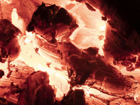 Macro shot of red hot coals in a fireplace.の写真素材
