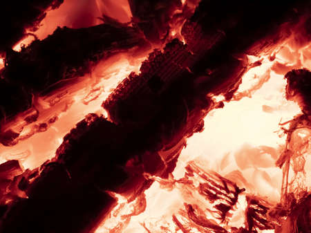Macro shot of red hot coals in a fireplace.の写真素材