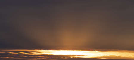 Sky 16: 9, sunset with rays under the clouds. Photo with zoom 105mmの写真素材
