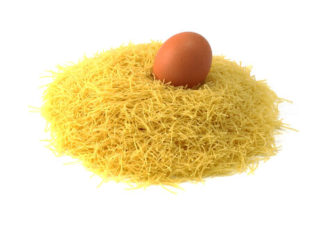 Heap of dry vermicelli, ingredient italian food, and egg の写真素材