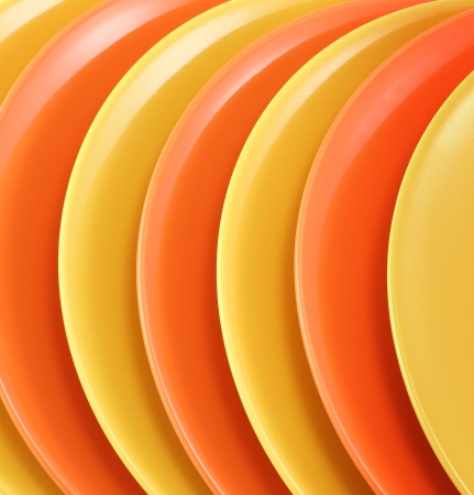 A stack of kitchen dishes on white background の写真素材