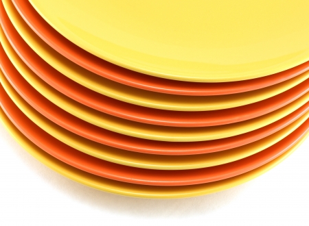 A stack of kitchen dishes on white background の写真素材