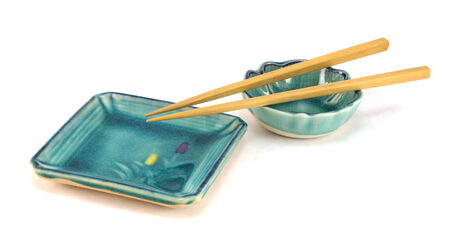 An empty sushi plates with chopsticks の写真素材