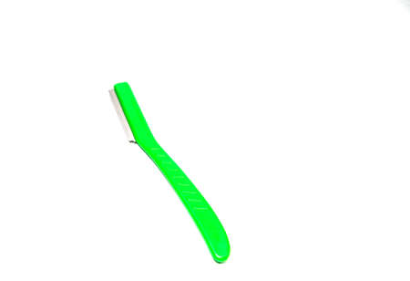 sharp green razor blade on white backgroundの写真素材