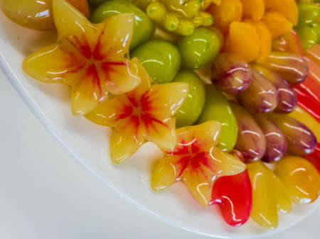 The plated desserts made with green beans. Coated with gelatin