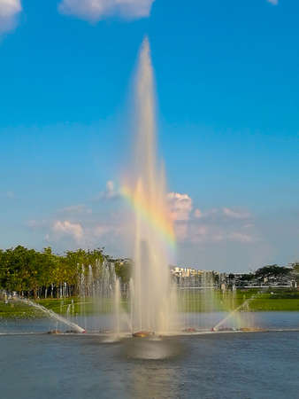 Rainbow over the spring caused a beautiful bright sunshineの写真素材