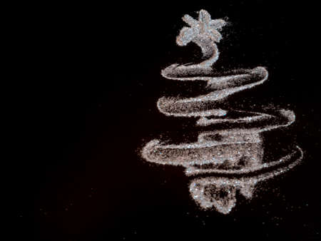 Christmas tree glitter by carborundum on black, background,  Christmas concept