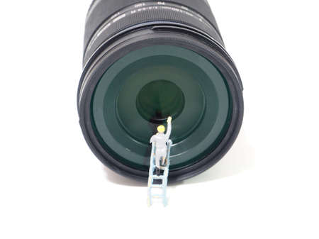 Miniature climb to cleaning camera lenの写真素材