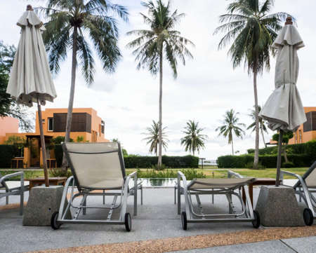 Pool chair inside swimming pool, relax conceptの写真素材