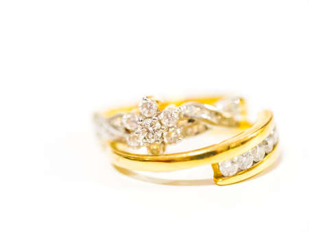 Two diamond engagement rings on blurred backgroundの写真素材