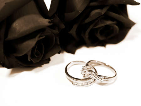 two wedding rings with black rose, true love conceptの写真素材