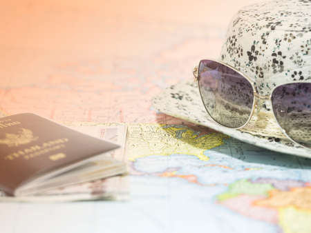 Time to take vacation with map passport and sunglass under sunlight, travel conceptの写真素材