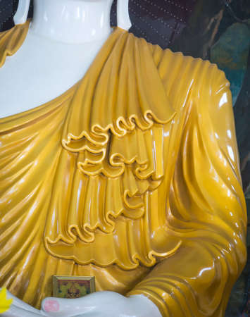 Abstract of striped robe on shiny gold of Buddhaの写真素材