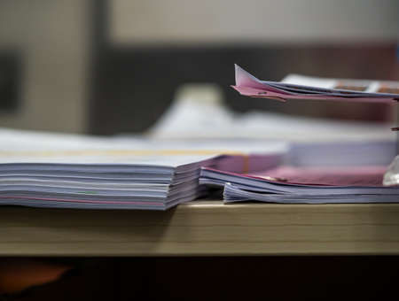 many jobs waiting to be done on the table, busy conceptの写真素材