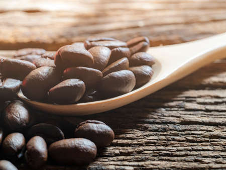 close up coffee beans on wooden tableの写真素材