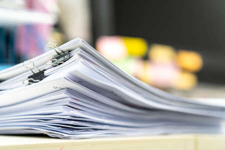 dicument, many jobs waiting to be done on the table, busy concept