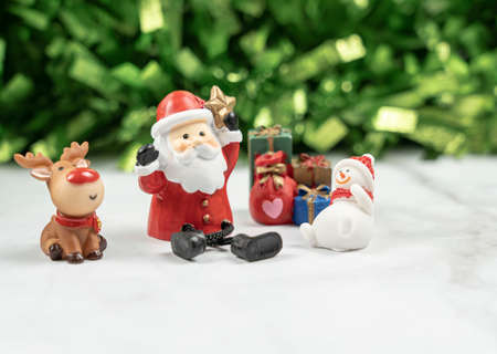 Santa Clause sitting   with gifts. Reindeer and bear snowman waiting for Christmas, happy and prosperity conceptの写真素材
