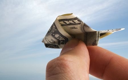 Airplane made from dollar banknoteの写真素材