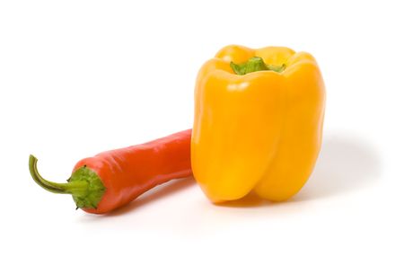Yellow  and red  peppers isolated on white with shadowsの写真素材