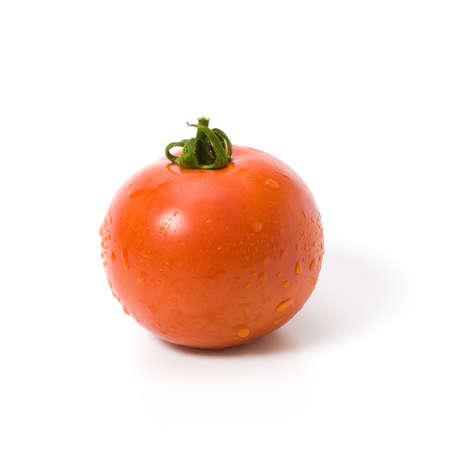 Fresh tomato isolated on white with shadowの写真素材