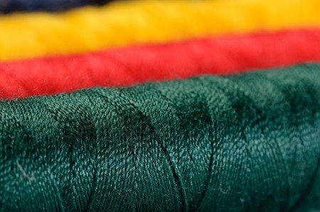 Some thread hanks of different colors closeupの写真素材