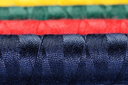 Some thread hanks of different colors closeupの写真素材