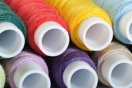 Some thread hanks of different colors closeupの写真素材