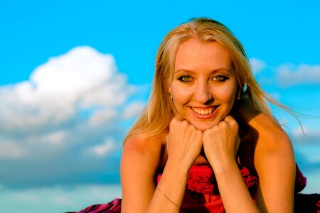 Pretty young woman relaxing outdoorsの写真素材