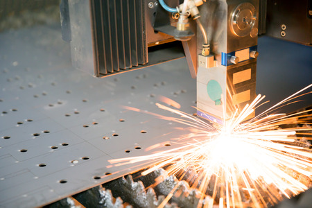 Industrial laser making holes in metal sheetの写真素材