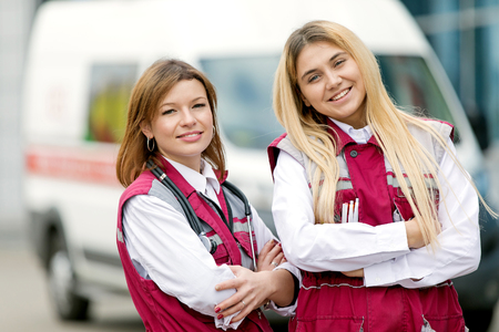 Emergency Medicine. Doctor with colleague paramedic on ambulance car backgroundの写真素材