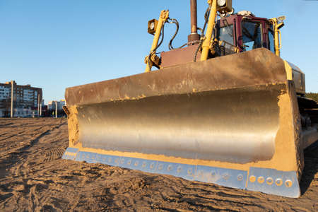 Construction equipment Bulldozer during earthmoving works at industrial areaの写真素材