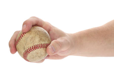 baseball in hand isolated on white backgroundの写真素材