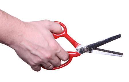 scissors in hand on a white backgroundの写真素材