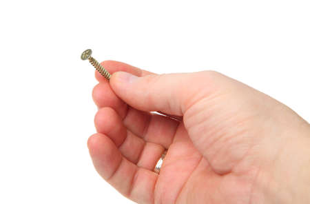 yellow metal screw isolated on a white backgroundの写真素材