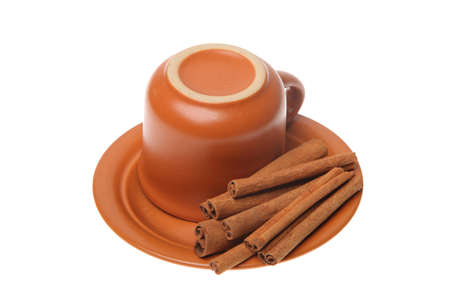 cinnamon and ceramic cup isolated on a white backgroundの写真素材