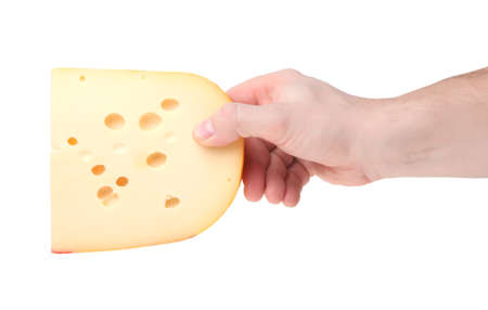 piece of cheese in a human hand isolated on a white backgroundの写真素材
