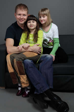 happy dad with two daughters teensの写真素材