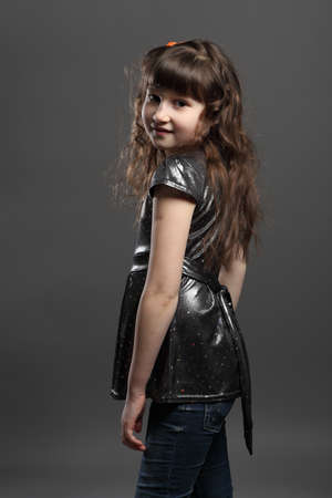 portrait of baby girl european exterior gray backgroundの写真素材