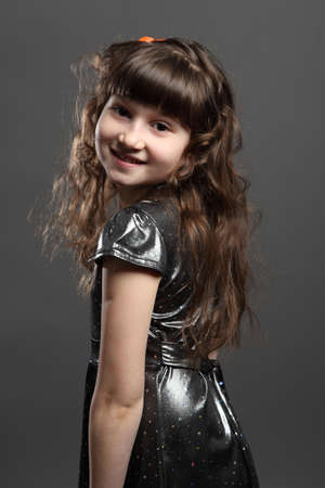 portrait of baby girl european exterior gray backgroundの写真素材