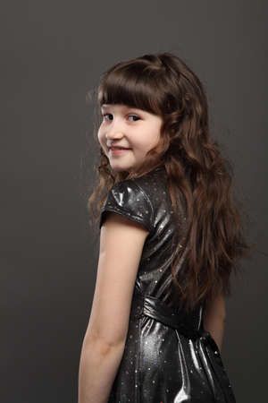 portrait of baby girl european exterior gray backgroundの写真素材