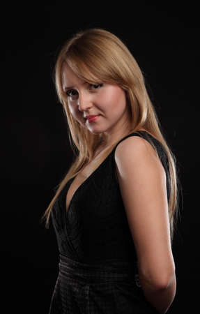 portrait of a beautiful woman on a black backgroundの写真素材