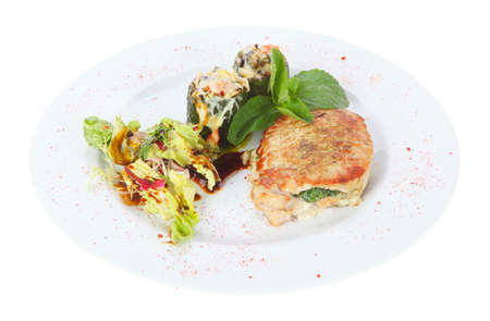 Chicken breast stuffed with spinach in a bowl isolated on white backgroundの写真素材