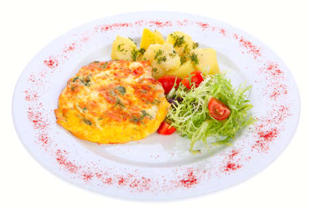 grilled meat on a plate garnished with fresh vegetables isolated on white backgroundの写真素材