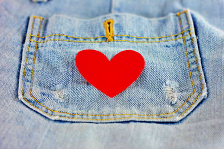red heart shape on pocket blue jeans